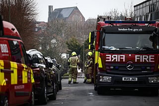 Firefighters are pictured in the Golders Green neighbourhood of north London on March 23, 2026, after volunteer ambulances run by a Jewish organisation were set on fire overnight.
