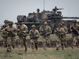  Servicemen of the United States 101 Airborne Division run during an exercise at the Mihail Kogalniceanu Air Base, near the Black Sea port of Constanta, Romania, Friday, March 31, 2023, in this file picture. 