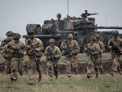  Servicemen of the United States 101 Airborne Division run during an exercise at the Mihail Kogalniceanu Air Base, near the Black Sea port of Constanta, Romania, Friday, March 31, 2023, in this file picture. 