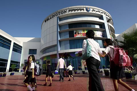 Parents and students head for the front doors of the GEMS Wellington International School in Al Sufouh, Dubai. Photo used for illustrative purposes