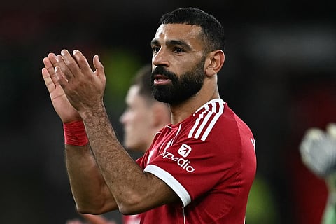 Liverpool's Egyptian striker #11 Mohamed Salah applauds the fans following the English Premier League football match between Liverpool and Aston Villa at Anfield in Liverpool, north west England on November 1, 2025.