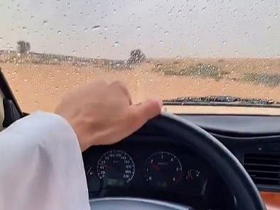 See Dubai in the rain: Sheikh Hamdan drives through desert outskirts