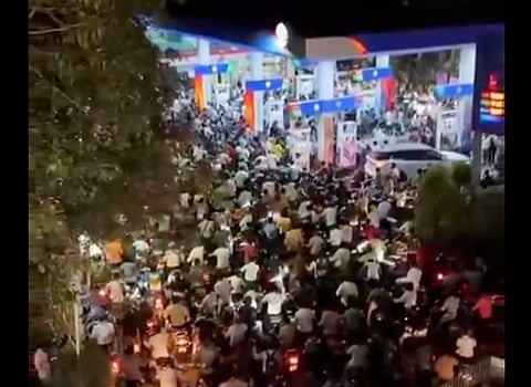 A screengrab taken from a video reportedly showing the situation at a fuel pump in Gujarat, India amid a worsening fuel supply crunch.