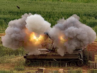 An Israeli self-propelled howitzer artillery gun fires rounds towards southern Lebanon from a position in the upper Galilee in northern Israel near the border on March 26, 2026. 