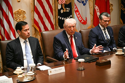 Trump, flanked by Secretary of State Marco Rubio (left) and Defence Secretary Pete Hegseth, speaks during a cabinet meeting in the Cabinet Room of the White House in Washington, DC, on March 26, 2026.