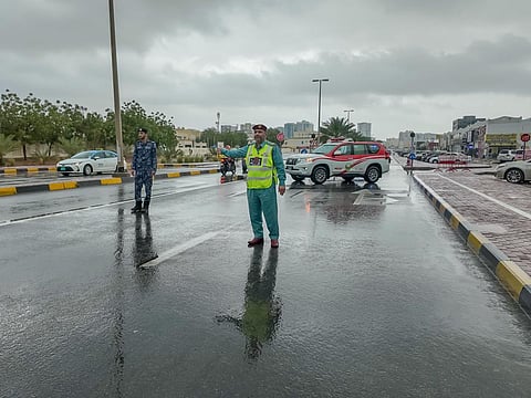 Ajman police during rain