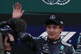 Mercedes driver Kimi Antonelli of Italy waves after the qualifying session of the Japanese Formula One Grand Prix at the Suzuka Circuit in Suzuka, Japan, Saturday, March 28, 2026. (AP Photo/Hiro Komae)