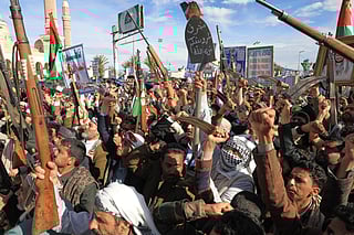 Houthi supporters shout slogans during a rally against Israel and the United States on March 27, 2026.