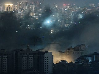 Smoke rises from the site of an Israeli airstrike in Beirut’s southern suburbs early on March 28, 2026.