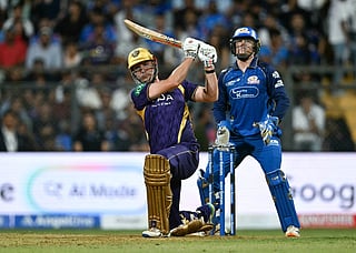 Kolkata Knight Riders' Australian cricket player Cameron Green (L) plays a shot as Mumbai Indian's South African cricket player Ryan Rickelton (R) looks on during the 2026 Indian Premier League (IPL) T20 match between Mumbai Indians and Kolkata Knight Riders at the Wankhede Stadium in Mumbai on March 29, 2026.