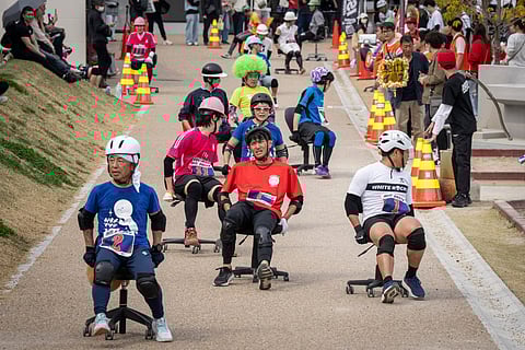 Teams race for rice in Japan's office-chair endurance contest