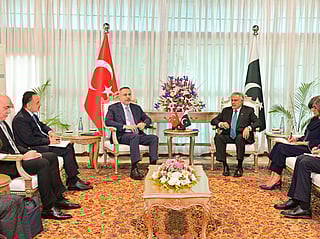 This handout photograph taken and released by Pakistan's Ministry of Foreign Affairs on March 29, 2026 shows Pakistan's Foreign Minister Ishaq Dar (R) speaking with his Turkish counterpart Hakan Fidan during their meeting at Foreign Ministry office in Islamabad.