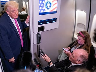 President Donald Trump speaks with members of the media onboard Air Force One on March 29, 2026 while en route to Joint Base Andrews, Maryland from West Palm Beach Florida.