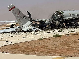 The wreckage of a US Air Force E-3 Sentry airborne warning and control aircraft sits on the tarmac at an air base in Saudi Arabia.