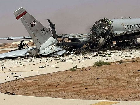 The wreckage of a US Air Force E-3 Sentry airborne warning and control aircraft sits on the tarmac at an air base in Saudi Arabia.