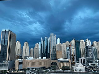 Rain clouds roll across Dubai’s skyline as towering skyscrapers of JLT and the Marina fade into a misty embrace, captured beautifully by Anupam Shivnani.