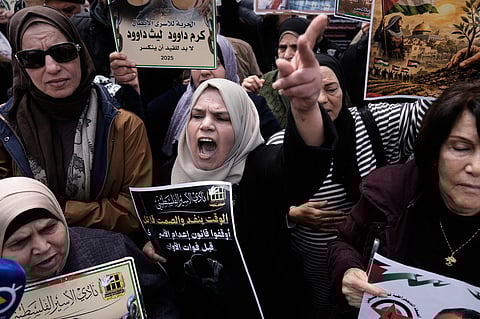 Palestinians demonstrate against the decision by Israel's parliament to approve the death penalty for Palestinians convicted of murdering Israelis in Nablus, West Bank, Tuesday, March 31, 2026. 