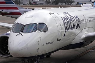 FILE - A Jet Blue Airlines jet pushes back from a gate at the Pittsburgh International Airport in Imperial, Pa., Feb. 13, 2026. (AP Photo/Gene J. Puskar, File)
