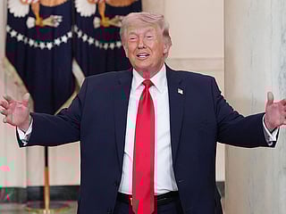 US President Donald Trump gestures after speaking at a televised address on the conflict in the Middle East from the Cross Hall of the White House in Washington, DC on April 1, 2026.  
