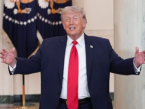 US President Donald Trump gestures after speaking at a televised address on the conflict in the Middle East from the Cross Hall of the White House in Washington, DC on April 1, 2026.  