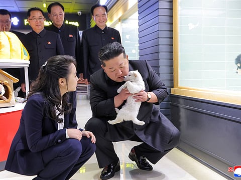 This undated picture released by North Korea's official Korean Central News Agency (KCNA) on April 3, 2026 shows North Korean leader Kim Jong Un (front R) and his daughter Kim Ju Ae (front L) inspecting a pet shop awaiting the opening of the fourth-stage district of the Hwasong Area in Pyongyang.