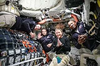 This screen grab from NASA's feed released on April 3, 2026, shows the four Artemis II crew members (L-R) Canadian Space Agency (CSA) astronaut Jeremy Hansen, Artemis II mission specialist, NASA astronauts Reid Wiseman, Artemis II commander, Christina Koch, Artemis II mission specialist and Victor Glover, Artemis II pilot as they head to orbit the Moon for the first time in more than half a century.