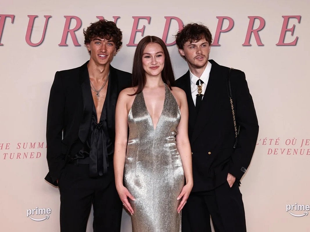 US actor Gavin Casalegno, US actress Lola Tung and US actor Christopher Briney on the red carpet upon arrival for the Special screening of the final episode of the serie "The Summer I turned pretty", in Paris, on September 17, 2025.