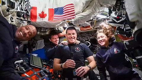 This screengrab taken from a NASA livestream shows Artemis II mission astronauts (L-R) NASA's pilot Victor Glover, NASA commander Reid Wiseman, Canadian Space Agency's mission specialist Jeremy Hansen and NASA's mission specialist Christina Koch as they attend a "VIP call" with Canadian children from inside the Orion spacecraft while on his way to the Moon on April 4, 2026.