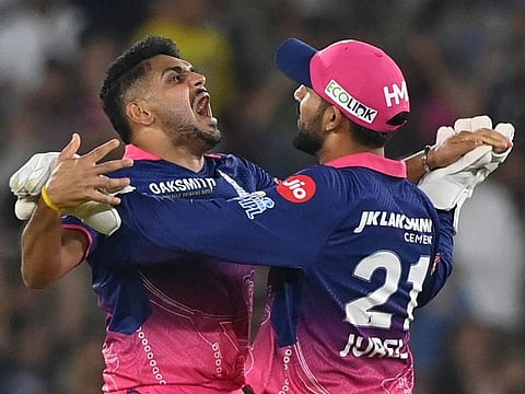 Rajasthan Royals' Indian cricket player Tushar Deshpande celebrates after taking the wicket of Gujarat Titans' captain Rashid Khan during the 2026 Indian Premier League (IPL) T20 match between Gujarat Titans and Rajasthan Royals at the Narendra Modi Stadium in Ahmedabad on April 4, 2026.