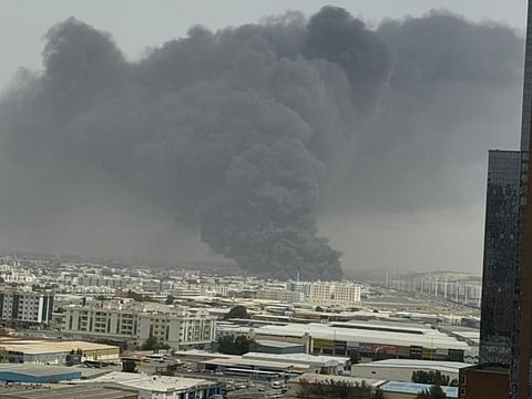 Civil Defence races to contain blaze and stop spread in busy industrial zone