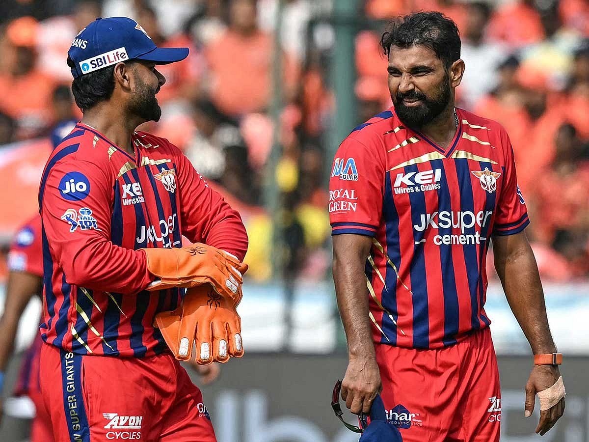 Lucknow Super Giants' Mohammed Shami (R) speaks with his captain Rishabh Pant during the IPL 2026 match againsit  Sunrisers Hyderabad at the Rajiv Gandhi International Stadium in Hyderabad on April 5, 2026. 