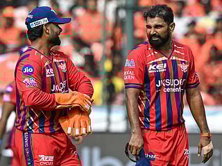 Lucknow Super Giants' Mohammed Shami (R) speaks with his captain Rishabh Pant during the IPL 2026 match againsit  Sunrisers Hyderabad at the Rajiv Gandhi International Stadium in Hyderabad on April 5, 2026. 