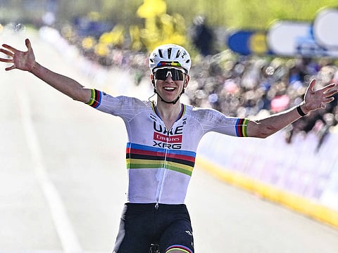 UAE Team Emirates  Slovenian rider Tadej Pogacar celebrates as he crosses the finish line to win the men's race of the Tour of Flanders' UCI WorldTour one day cycling race.