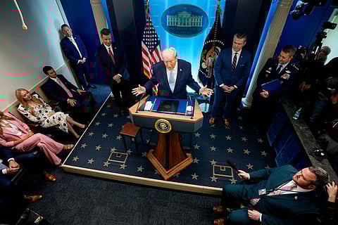 President Donald Trump, accompanied by CIA Director John Ratcliffe (C-L), Secretary of War Pete Hegseth (2nd-R) and Chairman of the Joint Chiefs of Staff General Dan Caine (R), speaks during a news conference in James S. Brady Press Briefing Room of the White House on April 06, 2026 in Washington, DC.
