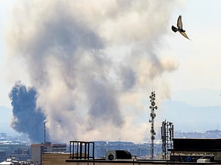 Smoke rises following strikes on Tehran on April 7, 2026.