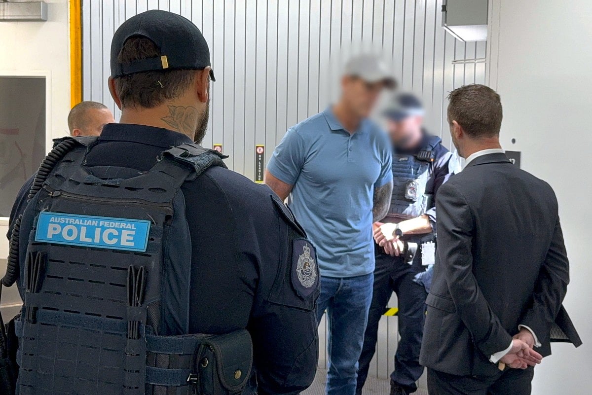This handout image taken and released on April 7, 2026 by the Australian Federal Police shows police arresting a 47-year-old former Australian soldier, who was widely named in local media as Victoria Cross recipient Ben Roberts-Smith, in Sydney.