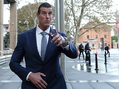 This handout image taken and released on April 7, 2026 by the Australian Federal Police shows police arresting a 47-year-old former Australian soldier, who was widely named in local media as Victoria Cross recipient Ben Roberts-Smith, in Sydney.