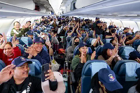 OFWs flying back to the Philippines