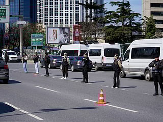 Turkish police secure the area after a gunmen attack at a building housing the Israeli Consulate in Istanbul, Turkey, Tuesday, April 7, 2026.  