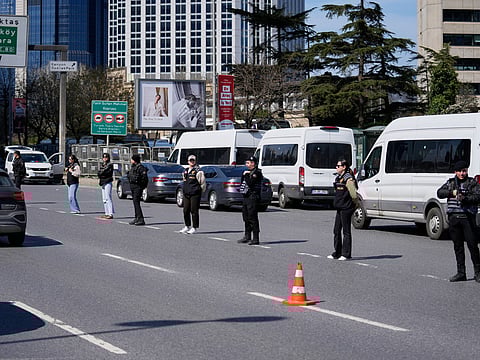 Turkish police secure the area after a gunmen attack at a building housing the Israeli Consulate in Istanbul, Turkey, Tuesday, April 7, 2026.  