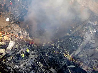 Firefighters attempt to extinguish a fire following an Israeli strike at the Corniche al-Mazraa neighbourhood of Beirut on April 8, 2026.