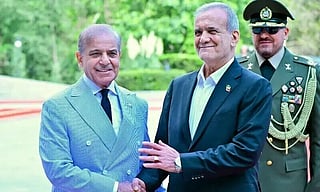Pakistan Prime Minister Shehbaz Sharif and Iranian President Masoud Pezeshkian. File photo