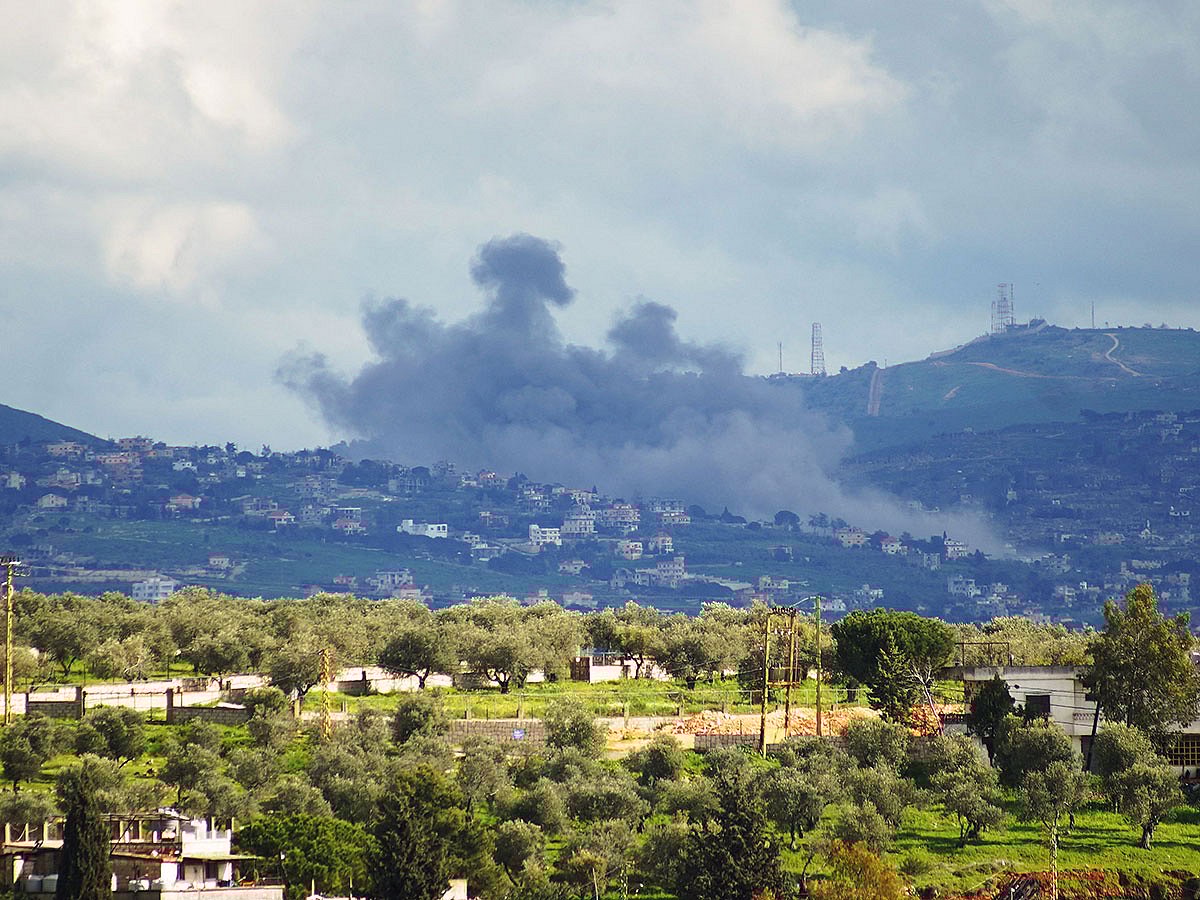 Smoke rises from the area of Houla caused by Israeli military activities as seen from the southern Lebanese city of Nabatieh.