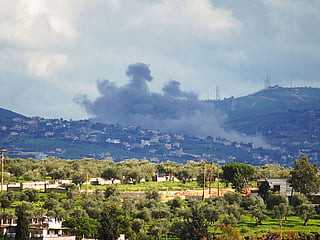 Smoke rises from the area of Houla caused by Israeli military activities as seen from the southern Lebanese city of Nabatieh.