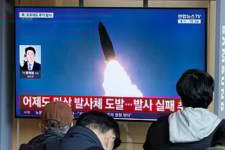 A TV screen shows a file image of North Korea's missile launch during a news program at Seoul Railway Station in Seoul, South Korea, Wednesday, April 8, 2026. (AP Photo/Ahn Young-joon)