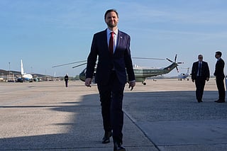 Vice President JD Vance walks to speak with the press before boarding Air Force Two for a departure to Pakistan on April 10, 2026 at Joint Base Andrews, Maryland.