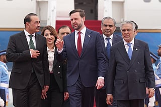 US Vice President JD Vance (C) walks with Pakistan's Chief of Defence Forces and Chief of Army Staff Field Marshall Asim Munir (L) and Pakistani Deputy Prime Minister and Foreign Minister Mohammad Ishaq Dar after arriving for talks with Iranian officials in Islamabad on April 11, 2026.