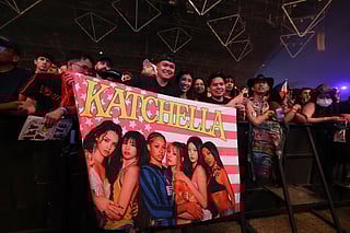 Fans hold a flag as the girl group Katseye performs during the 2026 Coachella Valley Music and Arts Festival at the Empire Polo Club in Indio, California on April 10, 2026.