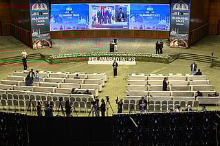Journalists work at a media facilitation center ahead of US–Iran peace talks in Islamabad on April 11, 2026.