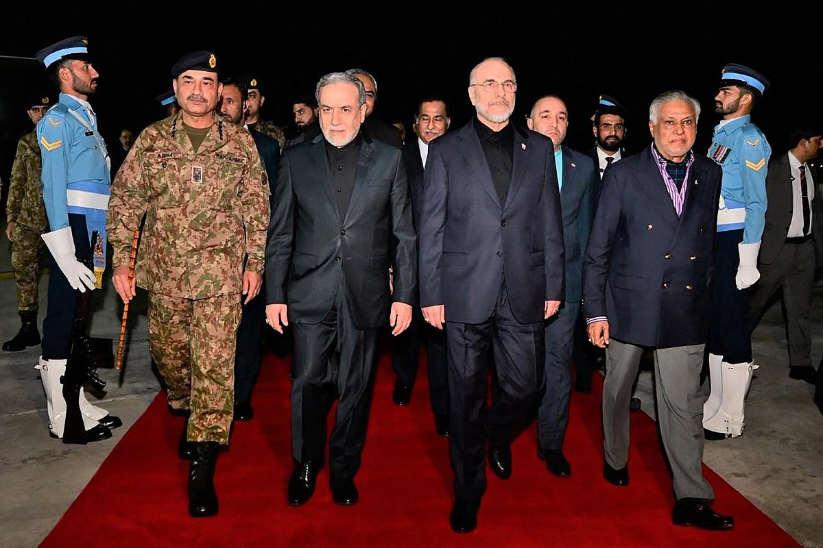 Pakistan's Foreign Minister Ishaq Dar (2nd R) and Army Chief Syed Asim Munir (2nd L) walking with Iran's Foreign Minister Abbas Araghchi (centre L) and Iran’s Parliament Speaker Mohammad Bagher Ghalibaf (centre R) upon their arrival at Nur Khan air base in Rawalpindi.